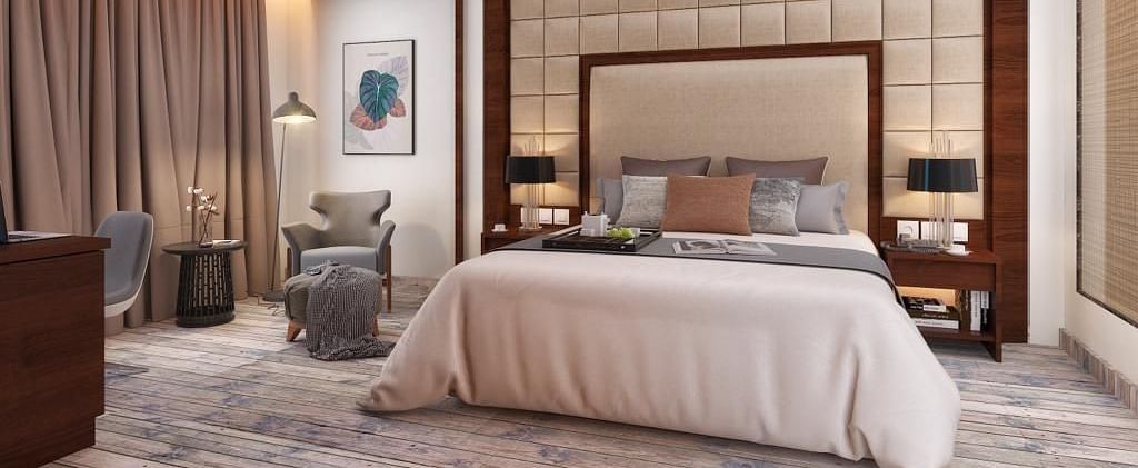 Suite with a king size bed and lamps on each side of the bed at BluSalzz Residence, Amritsar.
